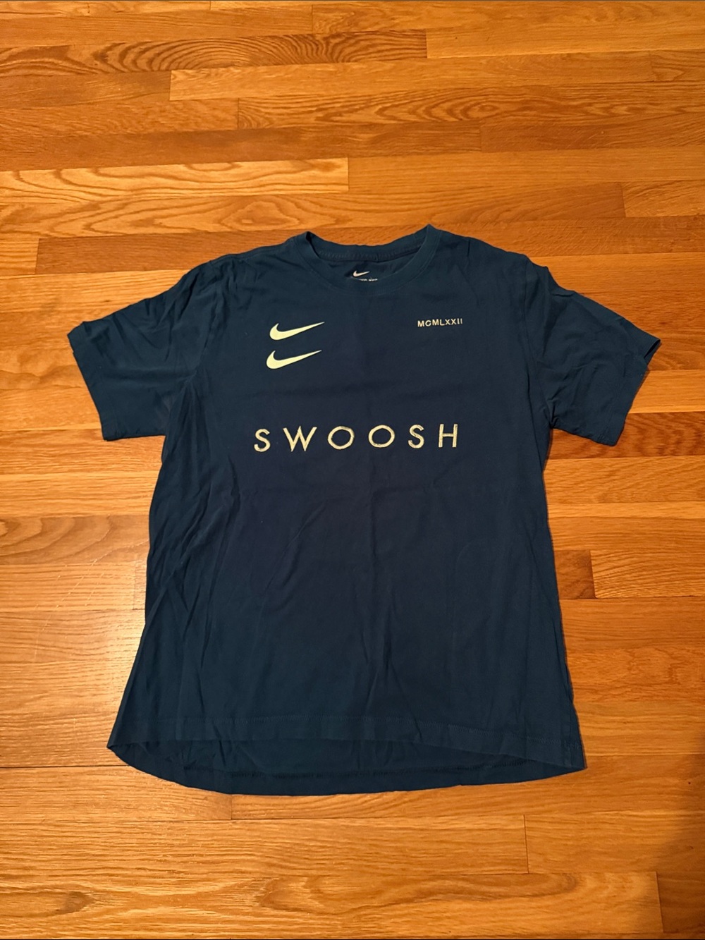 Nike teal T-Shirt with double light green Swoosh Graphics